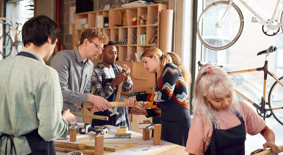 People in workshop from local business.