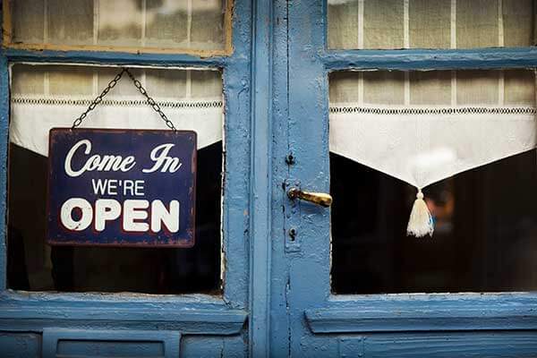 Open sign in the window of a local small business.