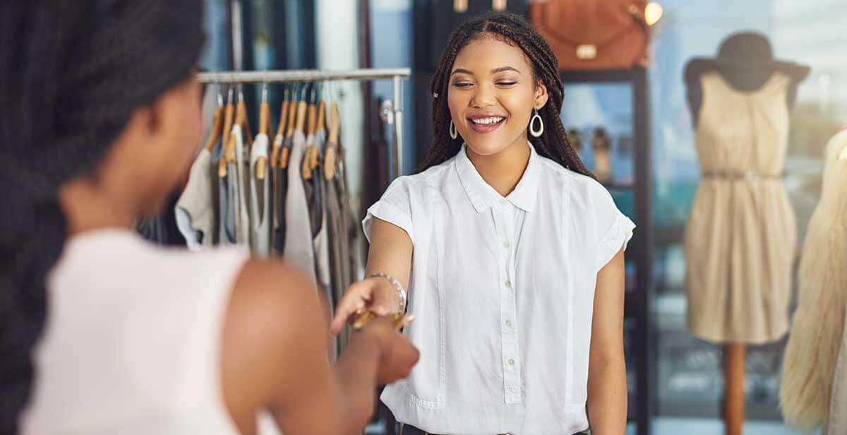 Woman paying for purchase.