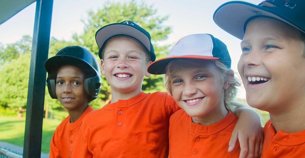 Young baseball players waiting to play.